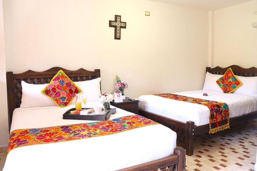 Mexican-style hotel accommodation with colorful textiles, view 2