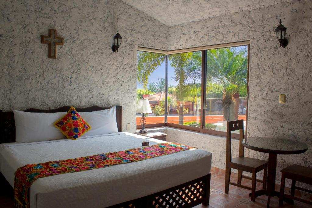 Mexican-style hotel accommodation with colorful textiles, view 1