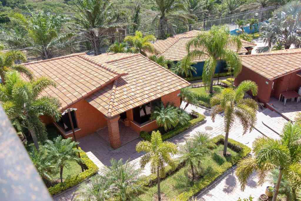 Palm-lined gardens and colorful bungalows at Camino Mexicano Hotel & Resort